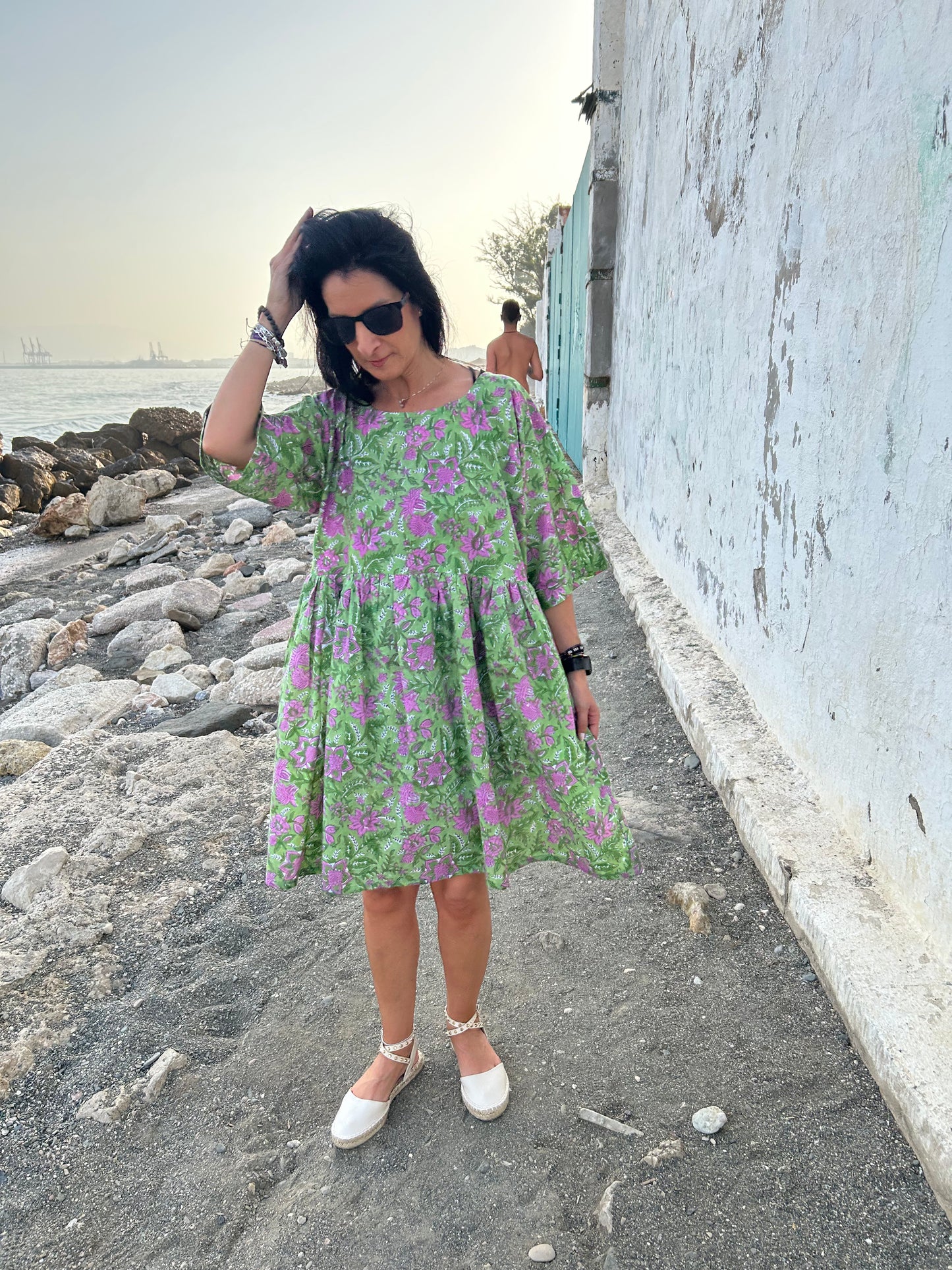 Purple flowers in a green garden Tunic