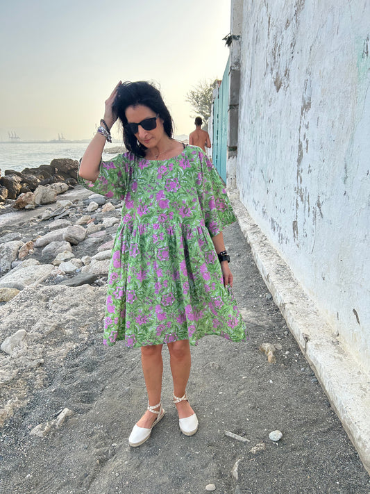 Purple flowers in a green garden Tunic