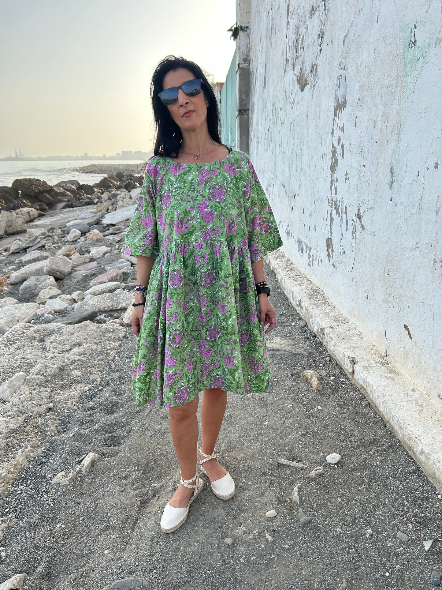 Purple flowers in a green garden Tunic