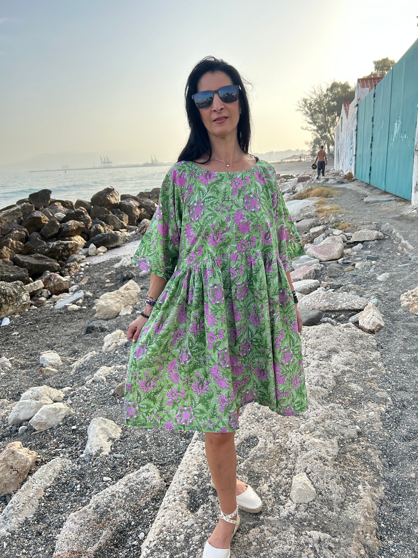 Purple flowers in a green garden Tunic